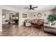 Inviting living room boasts modern ceiling fan, wood-look flooring and comfortable seating arrangement at 4655 E Farmdale Ave, Mesa, AZ 85206