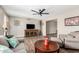 Cozy living room with stylish decor, ceiling fan, wood-look floors and open layout at 4655 E Farmdale Ave, Mesa, AZ 85206