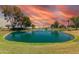 Picturesque pond featuring a fountain on the Sunland Village golf course at 4655 E Farmdale Ave, Mesa, AZ 85206