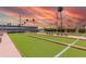 Outdoor shuffleboard court with seating, perfect for outdoor recreation and socializing at 4655 E Farmdale Ave, Mesa, AZ 85206