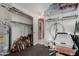 This cluttered storage room features shelving, tools, and other items at 4655 E Farmdale Ave, Mesa, AZ 85206