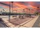 Well-maintained tennis court with lush green surroundings, providing a great space for recreation at 4655 E Farmdale Ave, Mesa, AZ 85206