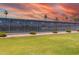 Well-maintained tennis court with lush green surroundings, providing a great space for recreation at 4655 E Farmdale Ave, Mesa, AZ 85206
