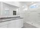 Bright bathroom with dual sink vanity, granite countertops, and a walk-in shower at 469 W Bunker Hill St, Florence, AZ 85132