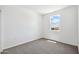 Bright bedroom with neutral carpet, a large window, and fresh paint at 469 W Bunker Hill St, Florence, AZ 85132