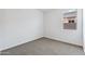 Bedroom with neutral carpet and a bright window allowing natural light at 469 W Bunker Hill St, Florence, AZ 85132