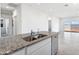 Spacious kitchen featuring a granite island and an open floor plan at 469 W Bunker Hill St, Florence, AZ 85132