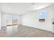 Bright living room with tile flooring, sliding glass door, and large window at 469 W Bunker Hill St, Florence, AZ 85132