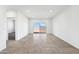 Open living room with neutral tile, fresh paint, and large sliding glass doors at 469 W Bunker Hill St, Florence, AZ 85132