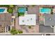 Aerial view of property showcasing two pools, desert landscaping, and ample parking at 5119 E Shaw Butte Dr, Scottsdale, AZ 85254