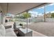 Beautiful backyard with covered patio, pool with safety fence, gravel area, and green landscaping at 5119 E Shaw Butte Dr, Scottsdale, AZ 85254