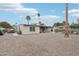 Spacious backyard features a gravel landscape, covered patio, and a fenced pool area, perfect for outdoor enjoyment at 5119 E Shaw Butte Dr, Scottsdale, AZ 85254