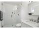 Modern all-white bathroom features glass enclosed shower, sleek fixtures, and a stylish vanity at 5119 E Shaw Butte Dr, Scottsdale, AZ 85254