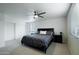 Spacious bedroom with carpet, ceiling fan, an oversized bed, and ample natural light at 5119 E Shaw Butte Dr, Scottsdale, AZ 85254