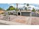 Charming single-story home with a well-maintained front yard, garage, and inviting front door at 5119 E Shaw Butte Dr, Scottsdale, AZ 85254
