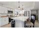 Modern kitchen with stainless steel appliances, white cabinets, and a functional center island at 5119 E Shaw Butte Dr, Scottsdale, AZ 85254