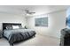 Minimalist main bedroom with a cozy king bed and plenty of natural light from the window at 5119 E Shaw Butte Dr, Scottsdale, AZ 85254