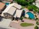 Expansive home with a lush backyard oasis, featuring a sparkling pool and mature landscaping for ultimate relaxation at 5216 W Oraibi Dr, Glendale, AZ 85308