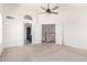 Open bedroom with neutral carpet, ceiling fan, and connecting doors to other rooms at 5216 W Oraibi Dr, Glendale, AZ 85308