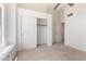 Bedroom featuring carpet, a window, and a closet with sliding doors at 5216 W Oraibi Dr, Glendale, AZ 85308