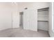 Well-lit bedroom with closet and interior door; neutral color scheme at 5216 W Oraibi Dr, Glendale, AZ 85308