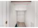 Walk-in closet with neutral carpet and a wood hanging rod at 5216 W Oraibi Dr, Glendale, AZ 85308