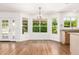 Bright dining room area featuring hardwood floors, plenty of natural light, and a granite counter top at 5216 W Oraibi Dr, Glendale, AZ 85308