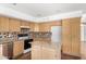 Kitchen featuring granite countertops, tile backsplash, and a convenient center island at 5216 W Oraibi Dr, Glendale, AZ 85308