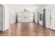 Spacious living room featuring hardwood floors, plenty of natural light, and a ceiling fan at 5216 W Oraibi Dr, Glendale, AZ 85308