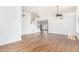 Spacious living room with soaring ceilings, gorgeous hardwood floors, and a staircase in view at 5216 W Oraibi Dr, Glendale, AZ 85308