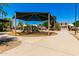 Community playground with slides and play structures under a shaded canopy at 5216 W Oraibi Dr, Glendale, AZ 85308