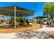 Community playground with covered play structure featuring multiple slides and play areas at 5216 W Oraibi Dr, Glendale, AZ 85308