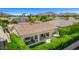 An aerial view of the backyard featuring an outdoor kitchen and dining area with mountain views at 5542 E Alan Ln, Paradise Valley, AZ 85253