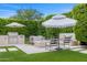 Serene outdoor space with barbecue, fire pit, manicured lawn, manicured hedges, and stylish outdoor seating at 5542 E Alan Ln, Paradise Valley, AZ 85253