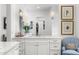 Elegant bathroom featuring double sinks, a large mirror, and decorative accents for a luxurious feel at 5542 E Alan Ln, Paradise Valley, AZ 85253