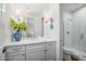 Stylish bathroom featuring a large vanity with a white countertop and a glass shower enclosure at 5542 E Alan Ln, Paradise Valley, AZ 85253