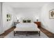 Bright bedroom featuring hardwood floors, side tables with lamps, and luxury linens at 5542 E Alan Ln, Paradise Valley, AZ 85253