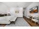 Spacious bedroom with hardwood floors, a TV, and a cozy seating area with decorative chairs at 5542 E Alan Ln, Paradise Valley, AZ 85253