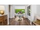 Bright foyer showcases beautiful hardwood floors and access to the living room at 5542 E Alan Ln, Paradise Valley, AZ 85253