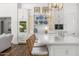 Bright kitchen features a large island with seating and custom cabinetry with display shelving at 5542 E Alan Ln, Paradise Valley, AZ 85253