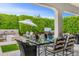 Beautiful outdoor patio with fire pit, covered seating area, and privacy landscaping in this charming home at 5542 E Alan Ln, Paradise Valley, AZ 85253