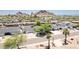 Panoramic aerial view of a residential neighborhood, showcasing a single-level home with mature landscaping and a pool at 6019 E Windsor Ave, Scottsdale, AZ 85257