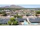 Bird's eye view of a residential neighborhood, showcasing a single-level home with mature landscaping and a pool at 6019 E Windsor Ave, Scottsdale, AZ 85257