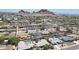 Overhead shot of a quiet, tree-lined neighborhood near desert mountains in Arizona at 6019 E Windsor Ave, Scottsdale, AZ 85257