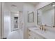 Bright bathroom boasts a vanity with marble countertop and access to outdoor patio at 6019 E Windsor Ave, Scottsdale, AZ 85257