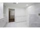 Bright bathroom features white cabinetry and tile and access to the walk-in closet at 6019 E Windsor Ave, Scottsdale, AZ 85257
