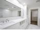 Bright bathroom features a double vanity with marble countertop and large mirror at 6019 E Windsor Ave, Scottsdale, AZ 85257