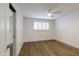 Clean bedroom design with hardwood flooring and modern ceiling fan at 6019 E Windsor Ave, Scottsdale, AZ 85257