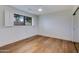 Cozy bedroom features hardwood flooring, wood shutters, and neutral walls at 6019 E Windsor Ave, Scottsdale, AZ 85257