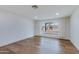 Bedroom with hardwood floors, white trim, recessed lights and view to front yard at 6019 E Windsor Ave, Scottsdale, AZ 85257